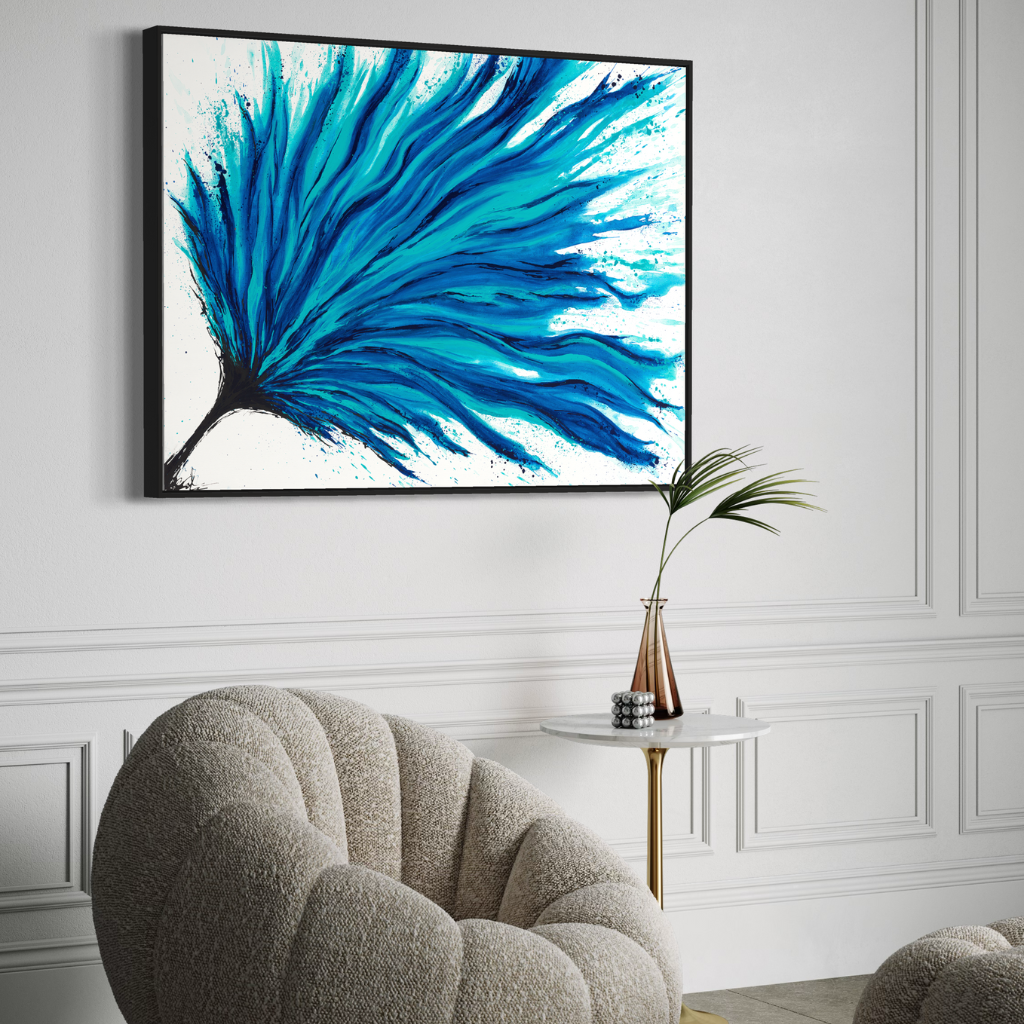 Add a splash of blue to your space with this modern abstract framed canvas print. A perfect addition of colour to any space. Choose from framed or non-framed options for a touch of elegance. Displayed on an egg white wall with comfy chair