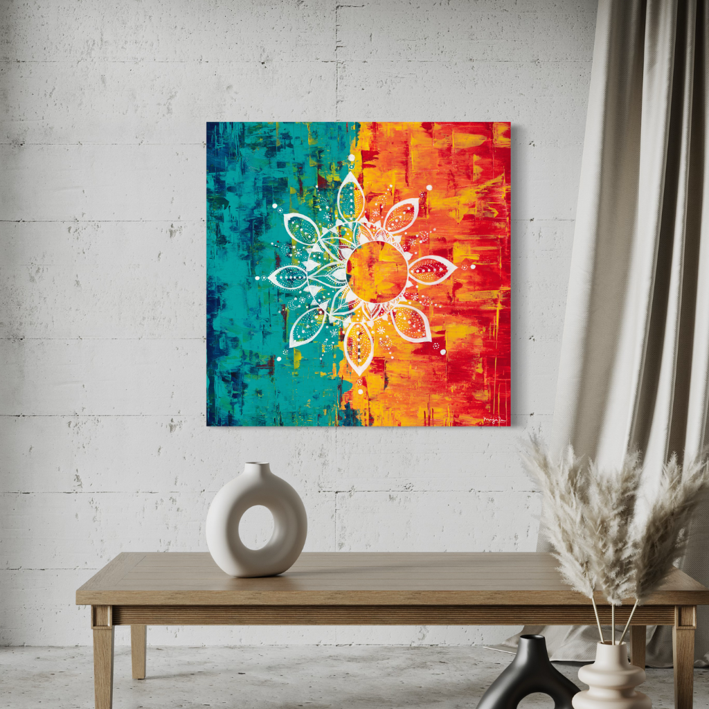 An exquisite Mandala artwork canvas print with the vibrant contrast of cool and warm colours. Handcrafted with precision to add a touch of elegance and calm to any space. Choose from framed or non-framed options. Displayed on a white brick wall with wooden bench.