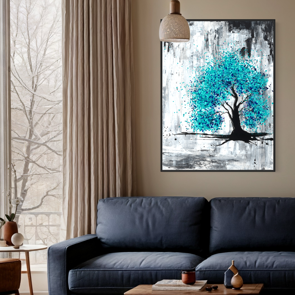 A framed canvas print with burst of blue on a grey and charcoal background, perfectly captures hope in darkness. A perfect addition to fill positivity in any space. Displayed on a beige wall with blue couch and linen curtains..