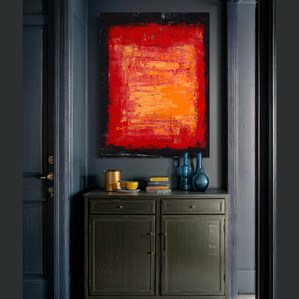 A bold and captivating artwork featuring burning red hues against a textured black background. This stunning abstract piece radiates intensity and passion, adding a touch of drama to any space. Hand-painted with exquisite detail, 'The Fire Within' is sure to ignite conversation and intrigue. Available in framed and non-framed options. displayed on a charcoal grey wall with rustic settng