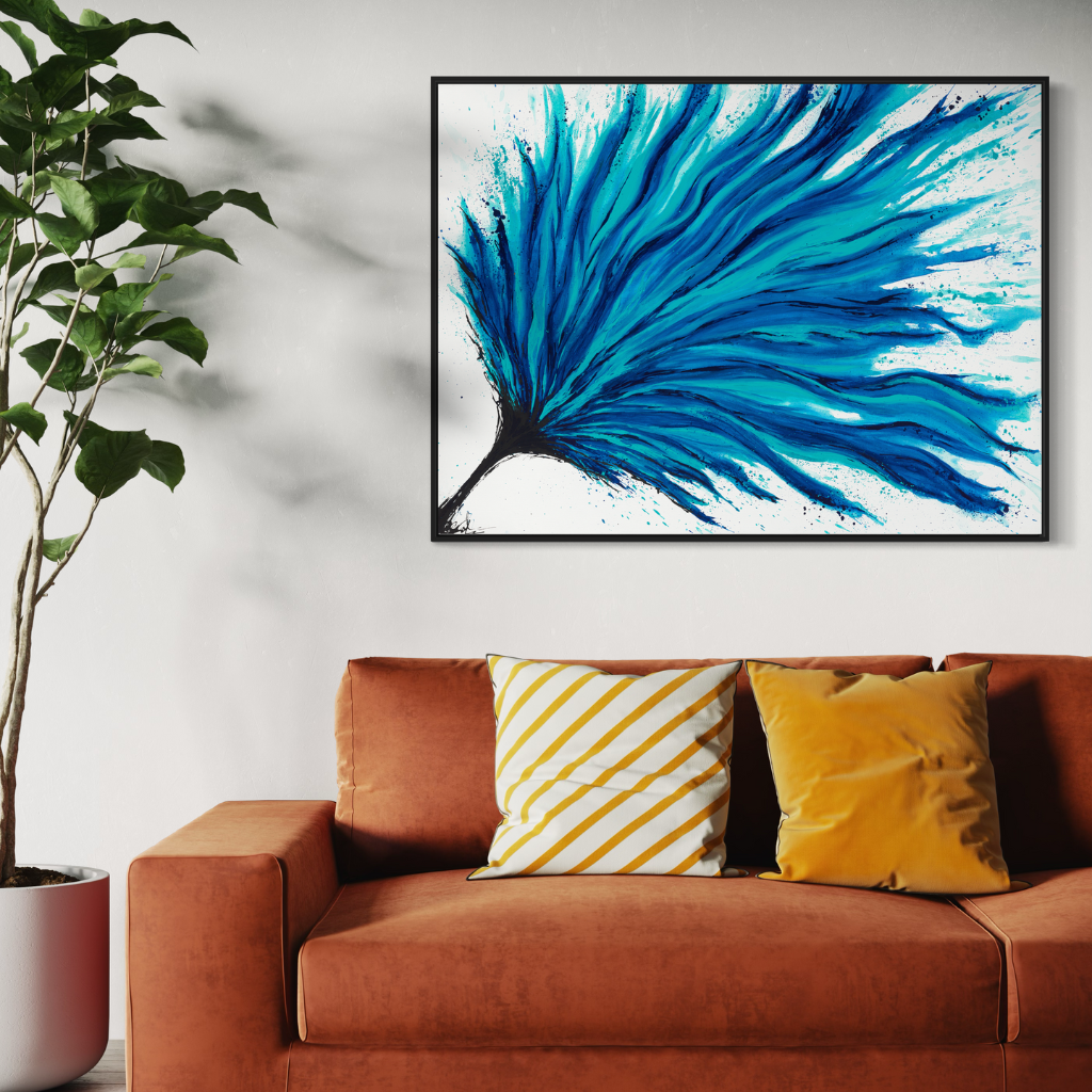 Add a splash of blue to your space with this modern abstract framed canvas print. A perfect addition of colour to any space. Choose from framed or non-framed options for a touch of elegance. Displayed on a white wall with orange couch.