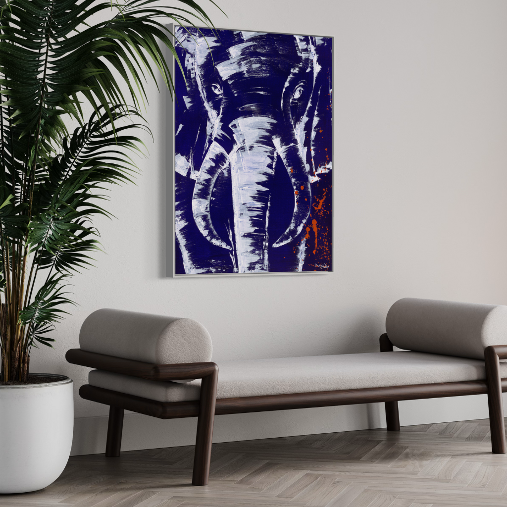 A stunning artwork that commands attention with its mighty presence against a serene blue background accented with intricate white knife work. The mighty elephant depicted in this piece exudes strength and grace, making it a striking focal point in any room. Available in framed or non-framed options.