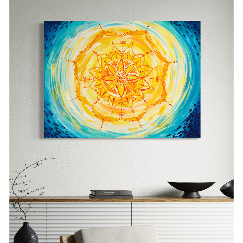 A captivating Mandala canvas print featuring a blend of cool blue raindrops with vibrant yellow and orange mandala. Handcrafted with precision and presented in a chic frame, this artwork adds elegance and tranquility to any space. Choose framed or non-framed options to suit your style and elevate your decor with harmony and sophistication. displayed on a white wall in the lounge