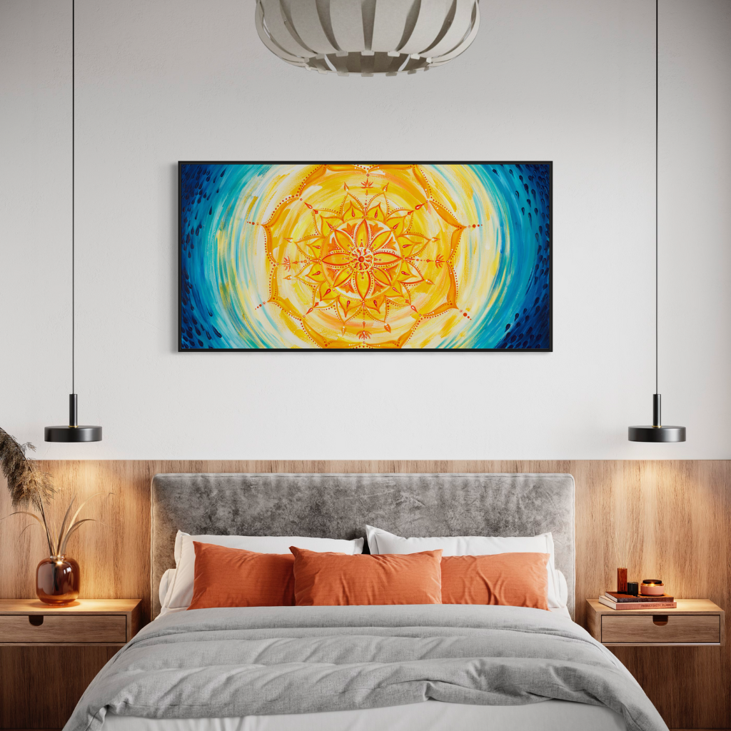 A captivating Mandala canvas print featuring a blend of cool blue raindrops with vibrant yellow and orange mandala. Handcrafted with precision and presented in a chic frame, this artwork adds elegance and tranquility to any space. Available in a panoramic view, framed or non-framed options to elevate your decor with harmony and sophistication. Displayed in a bedroom setting