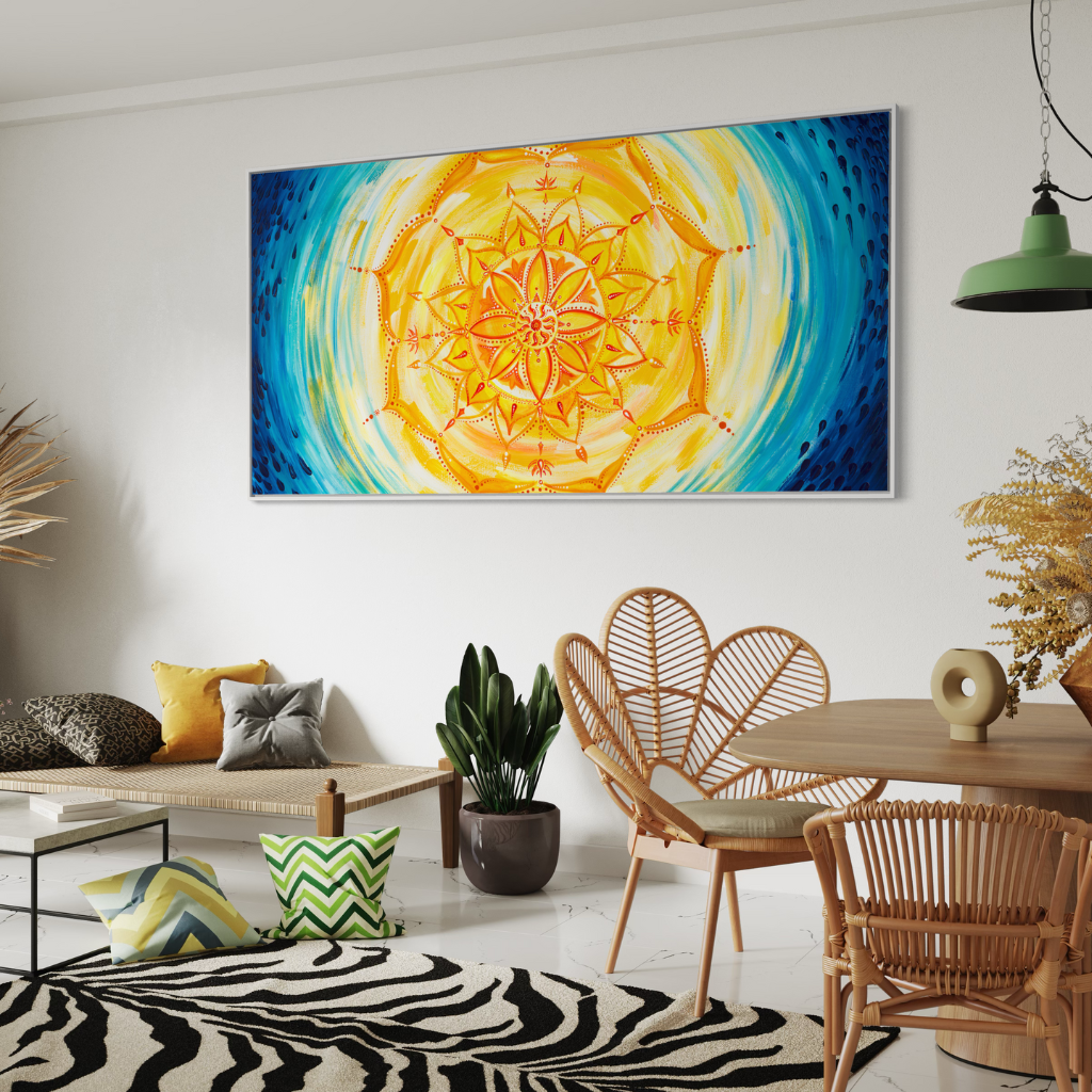 A captivating Mandala canvas print featuring a blend of cool blue raindrops with vibrant yellow and orange mandala. Handcrafted with precision and presented in a chic frame, this artwork adds elegance and tranquility to any space. Available in a panoramic view, framed or non-framed options to elevate your decor with harmony and sophistication. Displayed in a bohemian lounge setting.